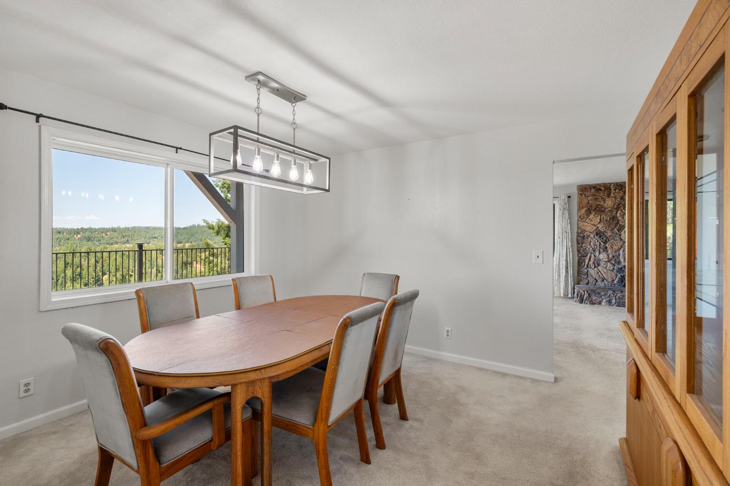 24835 Shake Ridge Road Volcano, CA 95689 - Photo 25 of 79 a view of a dining room with furniture window and outside view