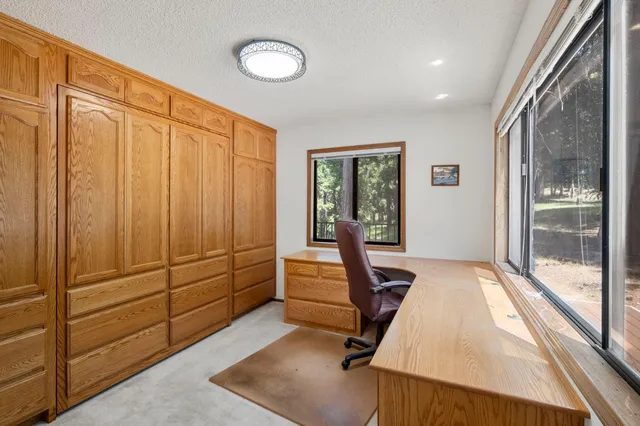 a view of an empty room with a ceiling fan