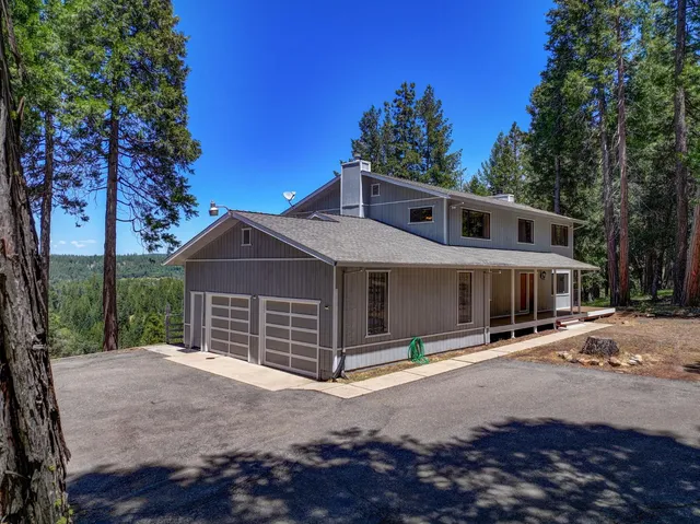 a view of a balcony with wooden floor and fence