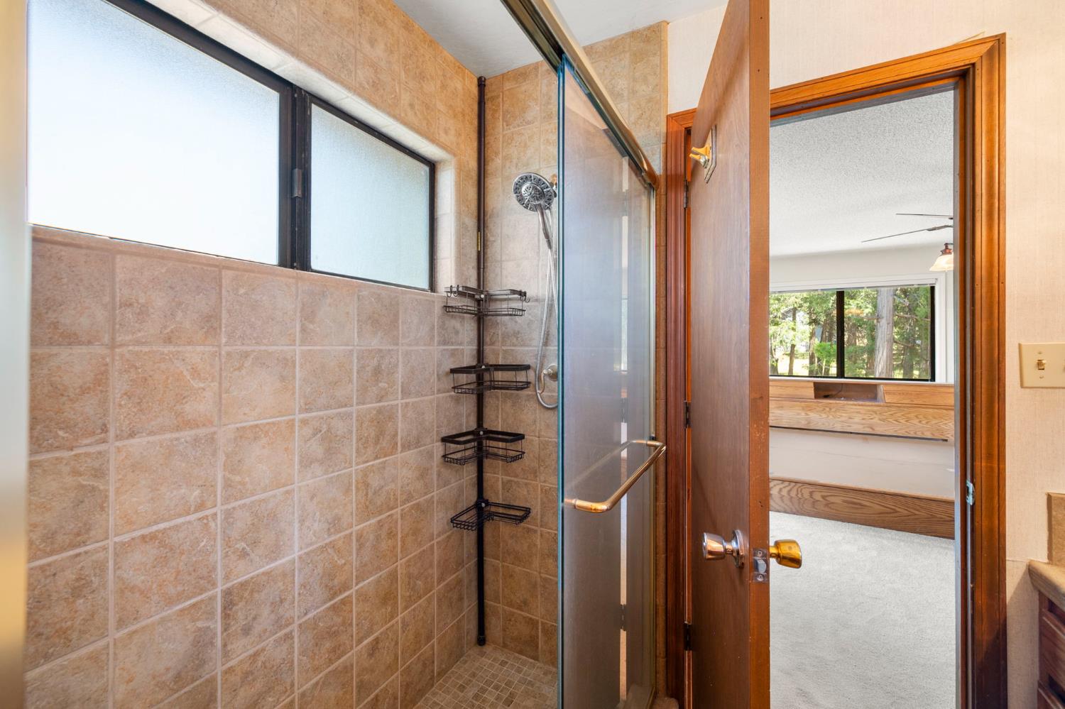 24835 Shake Ridge Road Volcano, CA 95689 - Photo 34 of 79 a bathroom with a shower
