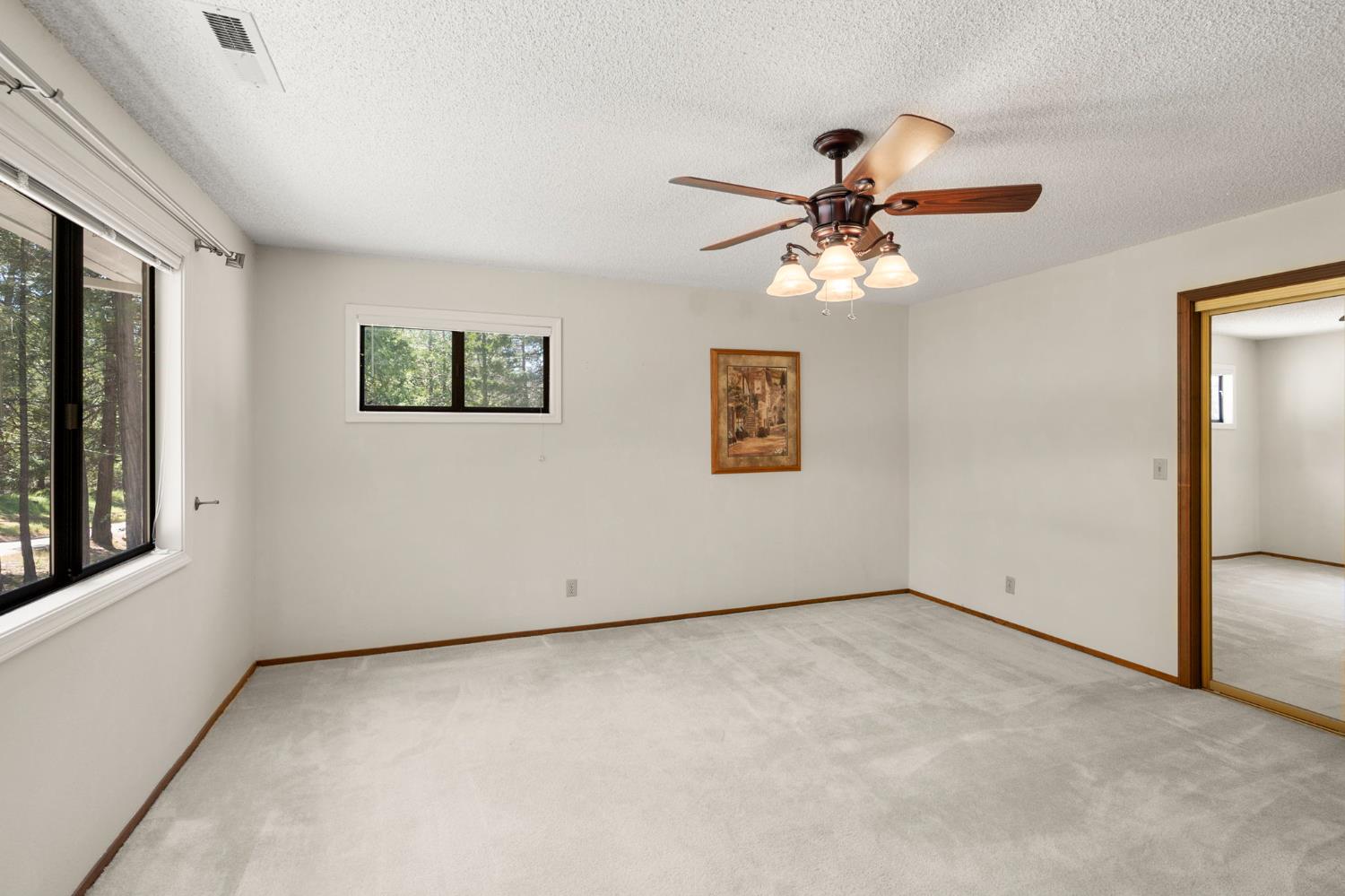 24835 Shake Ridge Road Volcano, CA 95689 - Photo 39 of 79 a view of an empty room with a window