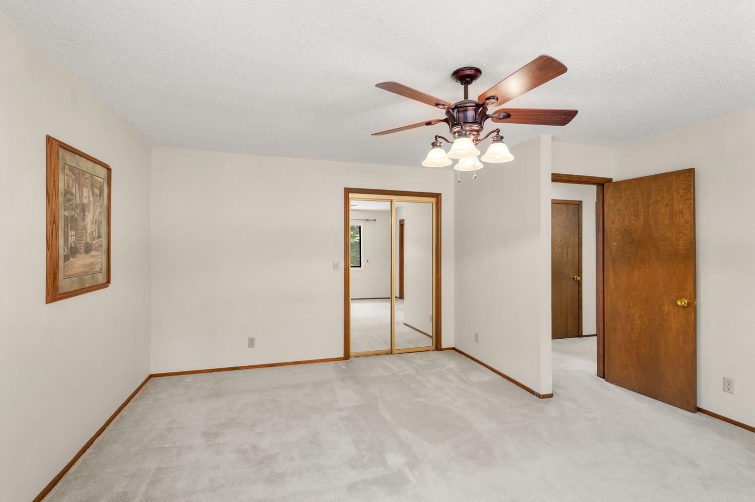 24835 Shake Ridge Road Volcano, CA 95689 - Photo 40 of 79 a view of an empty room with a ceiling fan