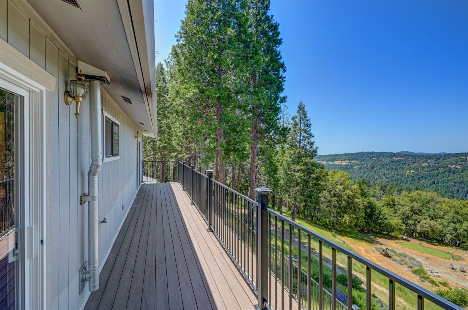 24835 Shake Ridge Road Volcano, CA 95689 - Photo 4 of 79 a view of a balcony with wooden floor and fence