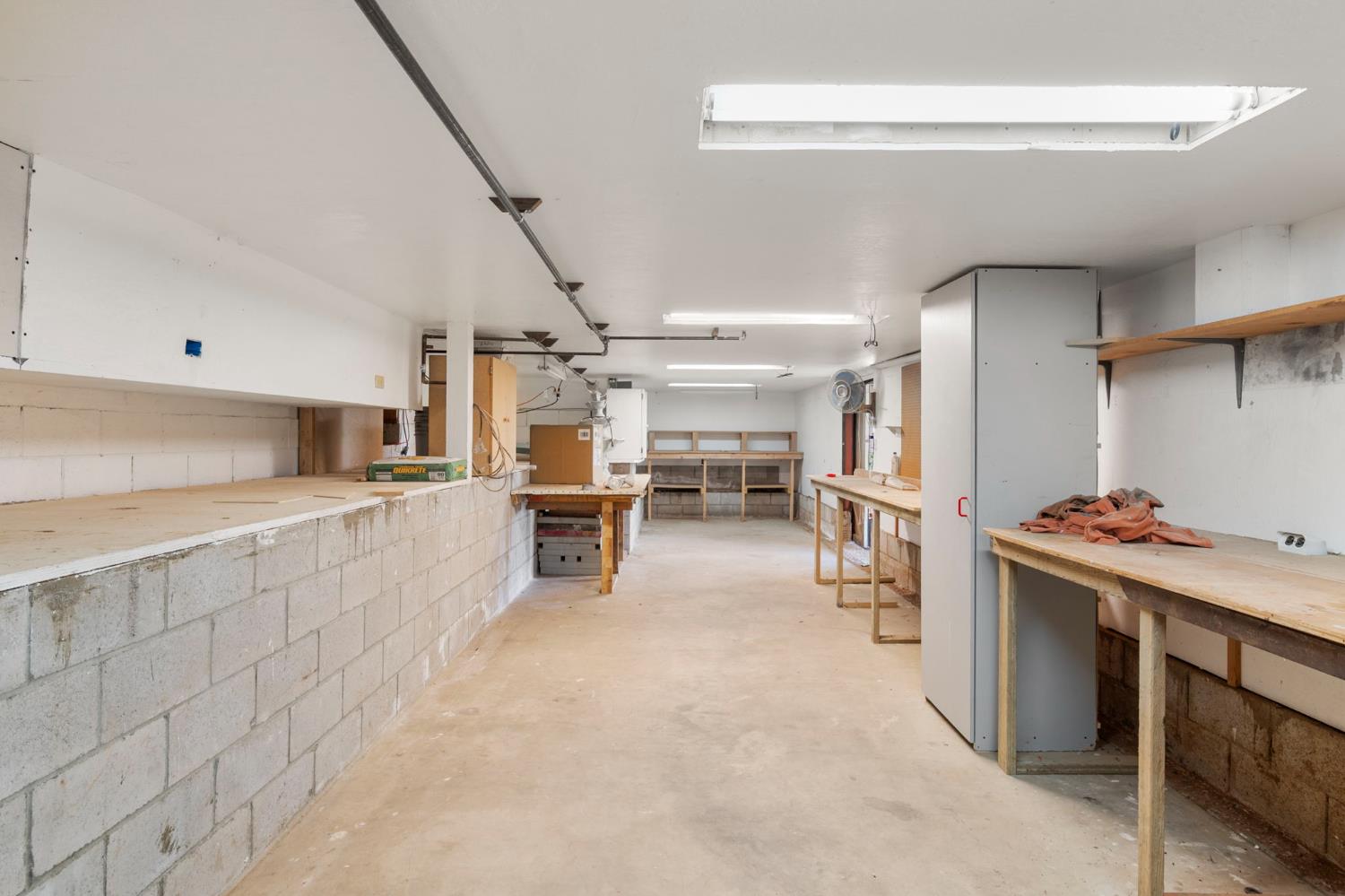 24835 Shake Ridge Road Volcano, CA 95689 - Photo 47 of 79 a room with a wooden furniture and a refrigerator