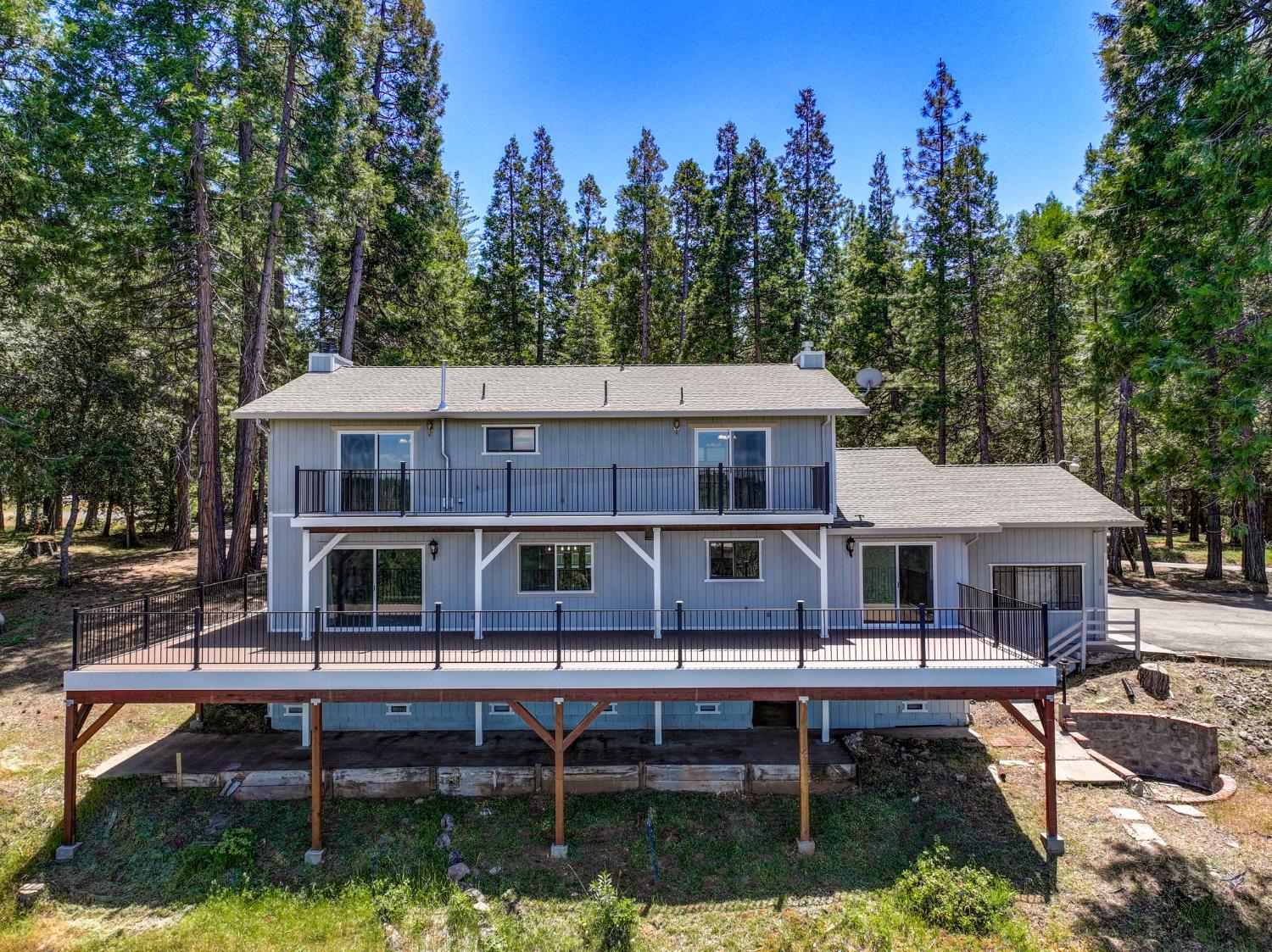 24835 Shake Ridge Road Volcano, CA 95689 - Photo 49 of 79 a aerial view of a house with swimming pool and sitting area