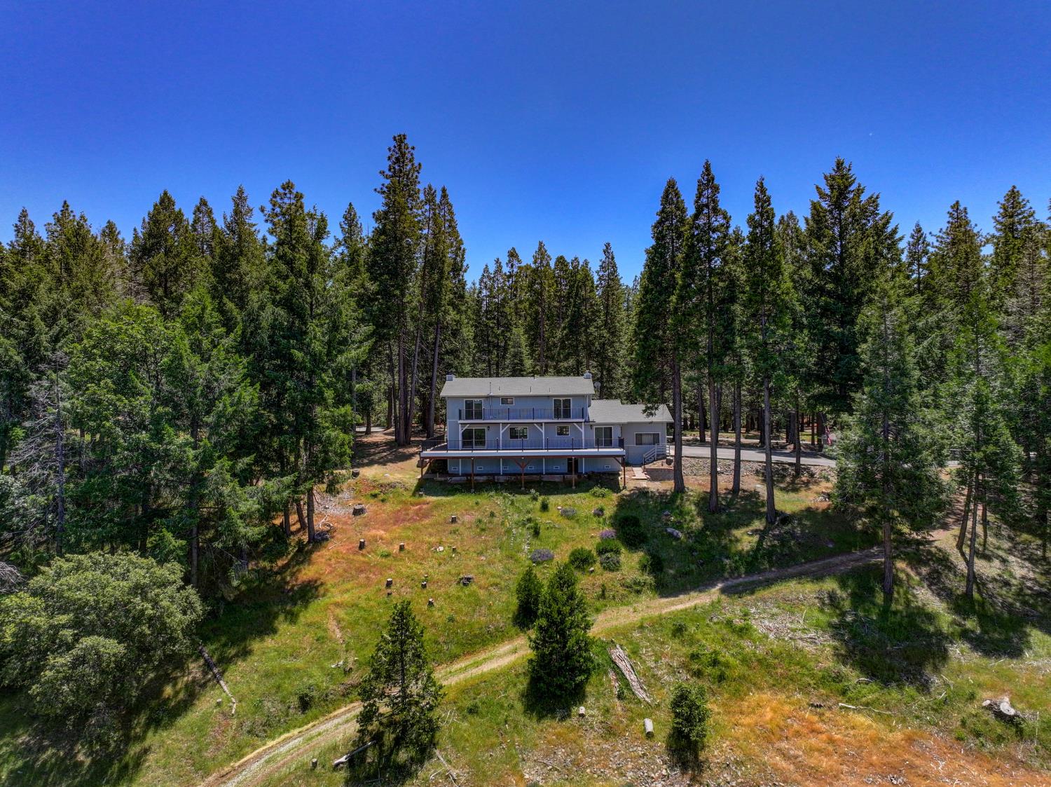 24835 Shake Ridge Road Volcano, CA 95689 - Photo 55 of 79 a view of a garden with a house in the background