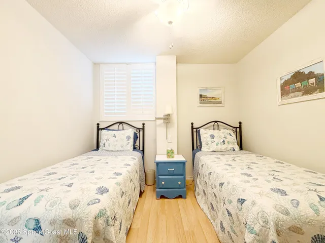 a bedroom with double bed and a window