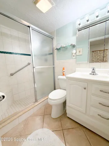 a bathroom with a toilet sink and shower