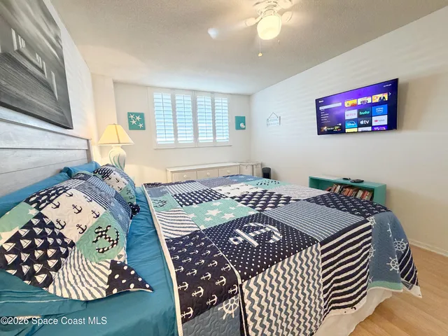 a bedroom with bed and a window