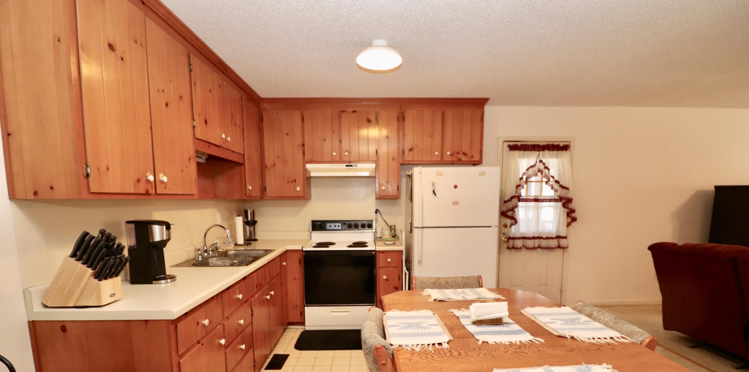 1658 Dugspur Road Callaway, VA 24067 - Photo 5 of 35 a kitchen with a refrigerator and a stove top oven