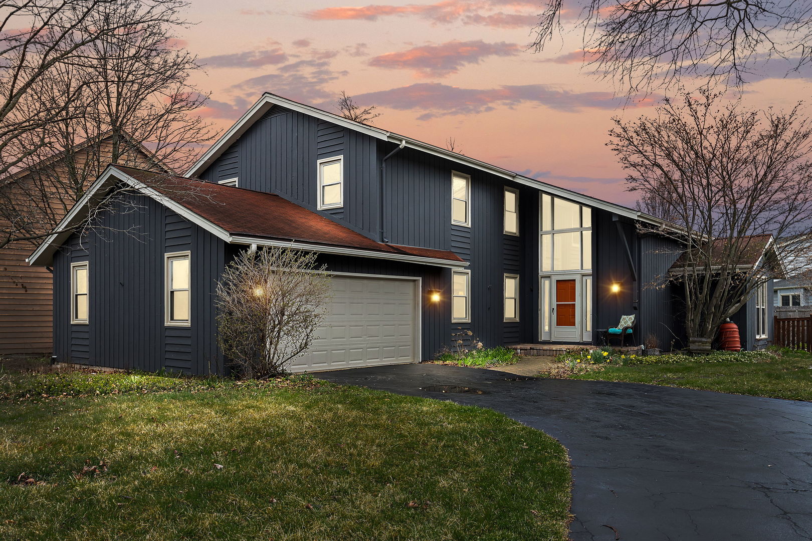 2660 Sun Valley Road Lisle, IL 60532 - Photo 1 of 27 a front view of a house with a yard and garage