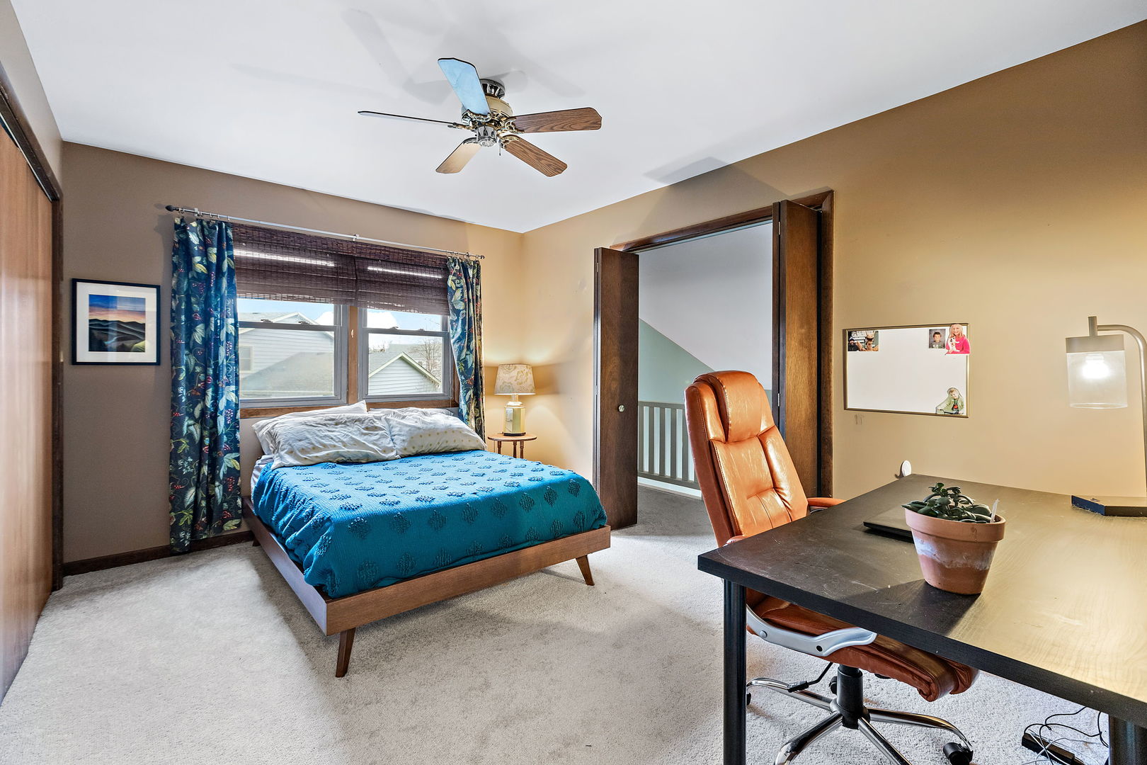 2660 Sun Valley Road Lisle, IL 60532 - Photo 19 of 27 a bedroom with a bed a table and chair
