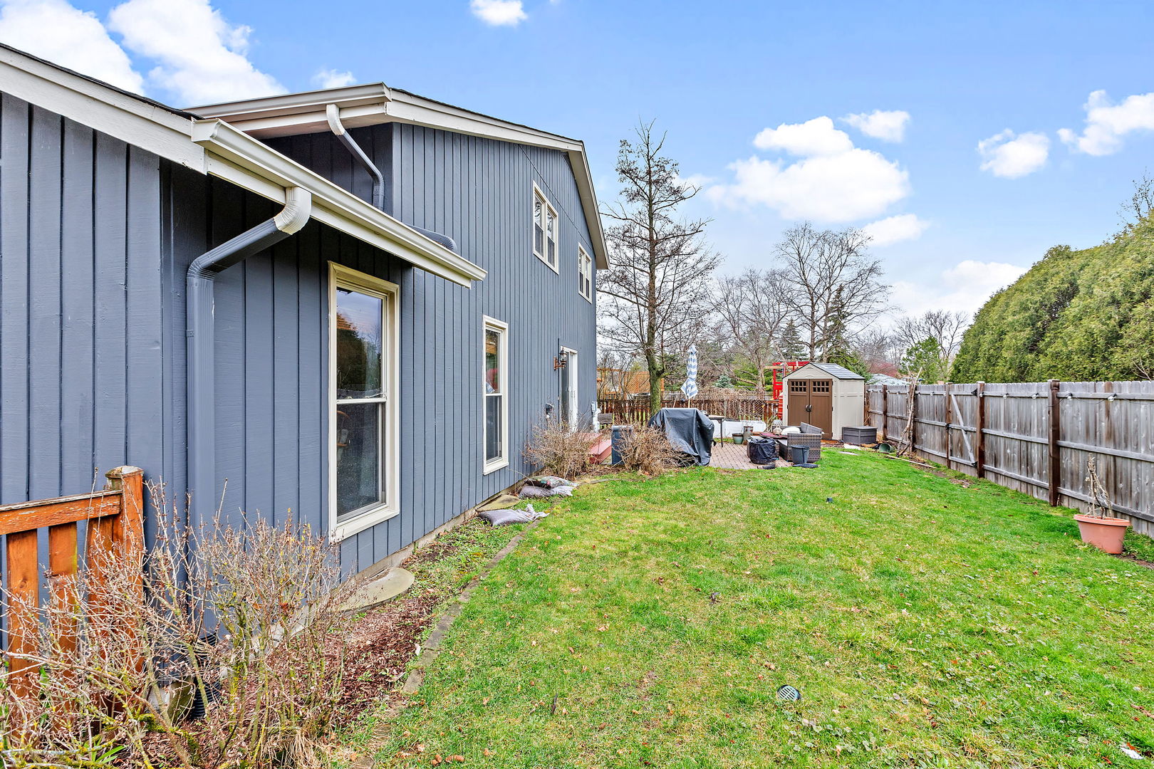 2660 Sun Valley Road Lisle, IL 60532 - Photo 23 of 27 a backyard of a house with wooden fence