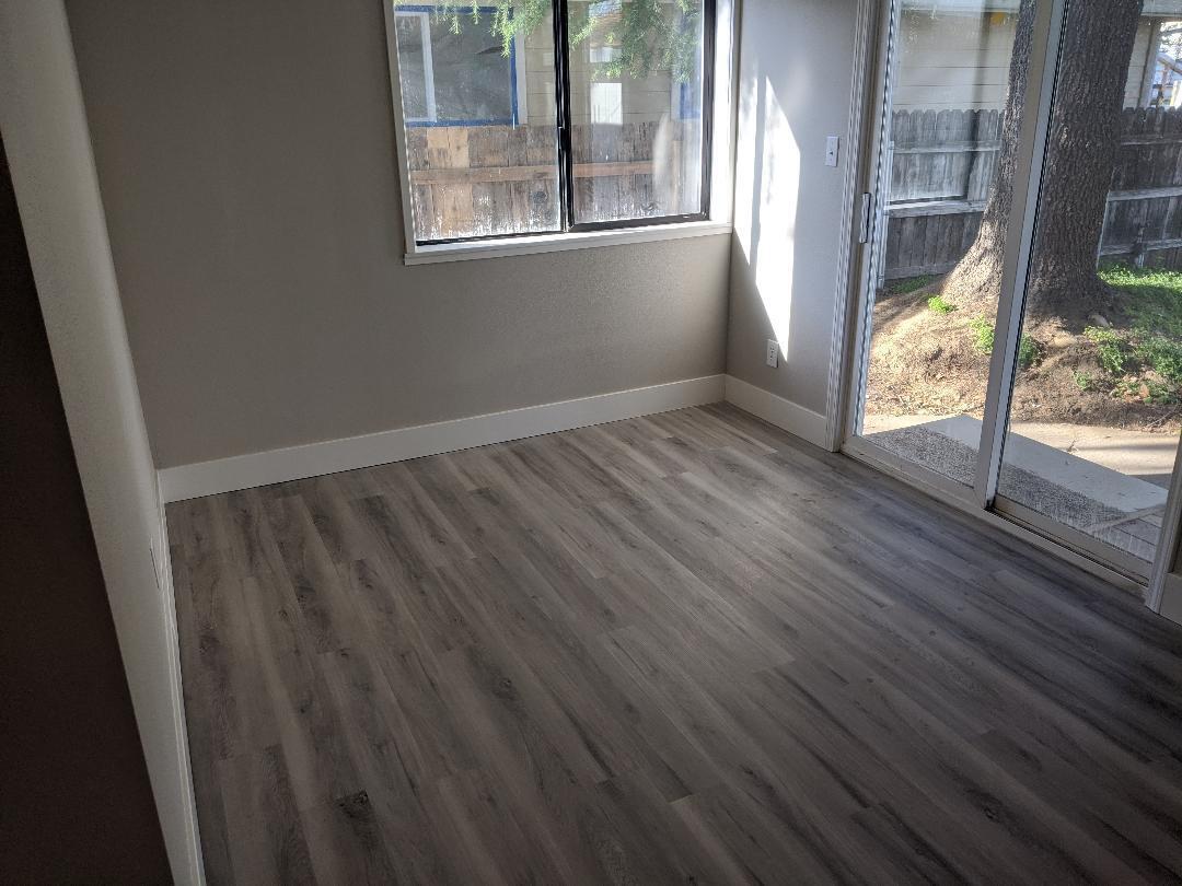 1012 State Street Redding, CA 96001 - Photo 13 of 23 a view of an empty room with wooden floor and a window