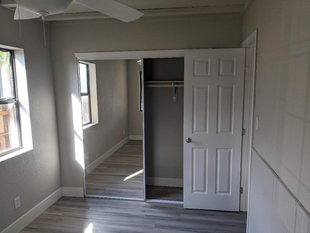 1012 State Street Redding, CA 96001 - Photo 15 of 23 a view of empty room with wooden floor and entryway