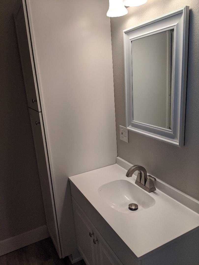 1012 State Street Redding, CA 96001 - Photo 18 of 23 a bathroom with a sink and a mirror