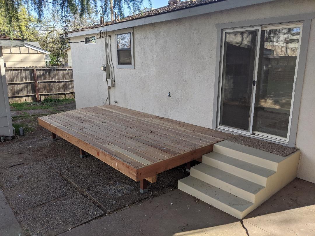 1012 State Street Redding, CA 96001 - Photo 21 of 23 a wooden bench sitting in front of a house