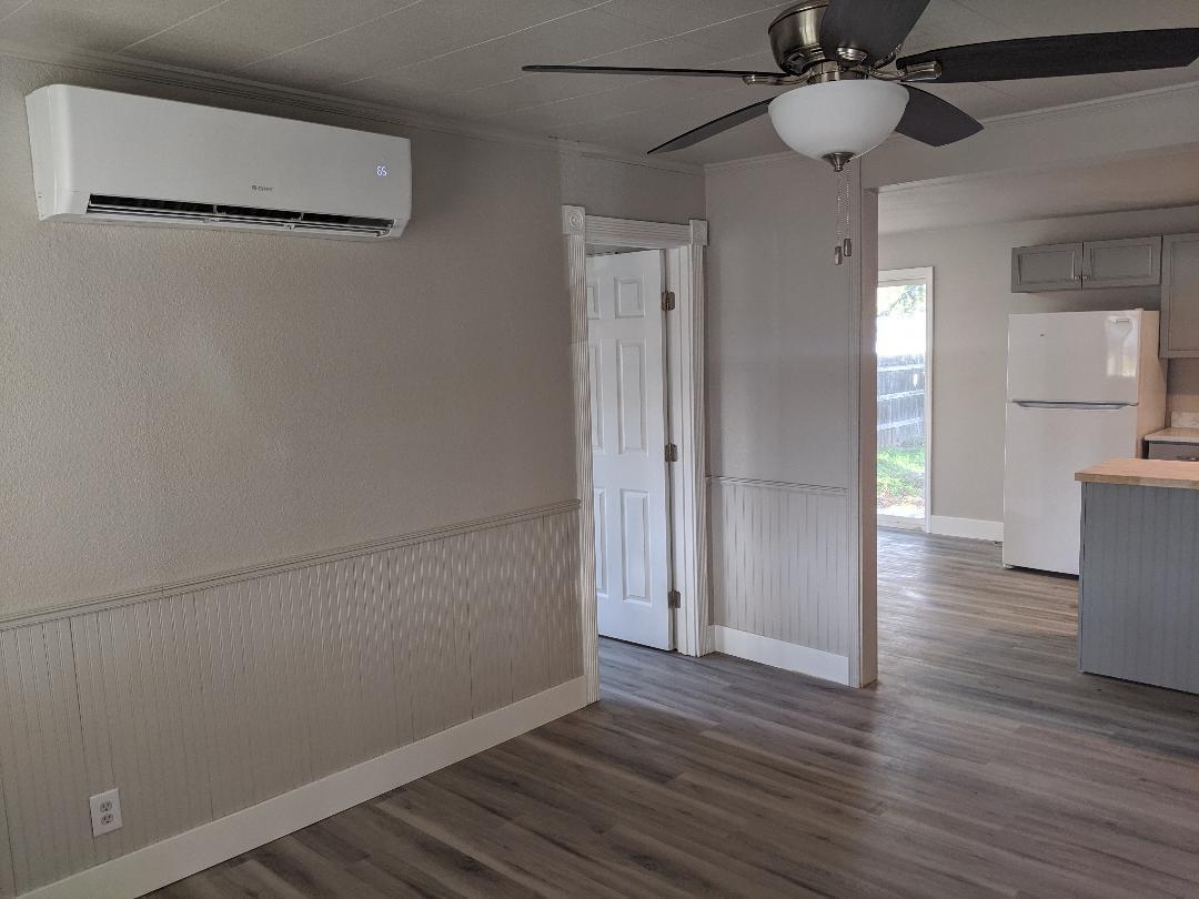 1012 State Street Redding, CA 96001 - Photo 6 of 23 a view of empty room with wooden floor and fan