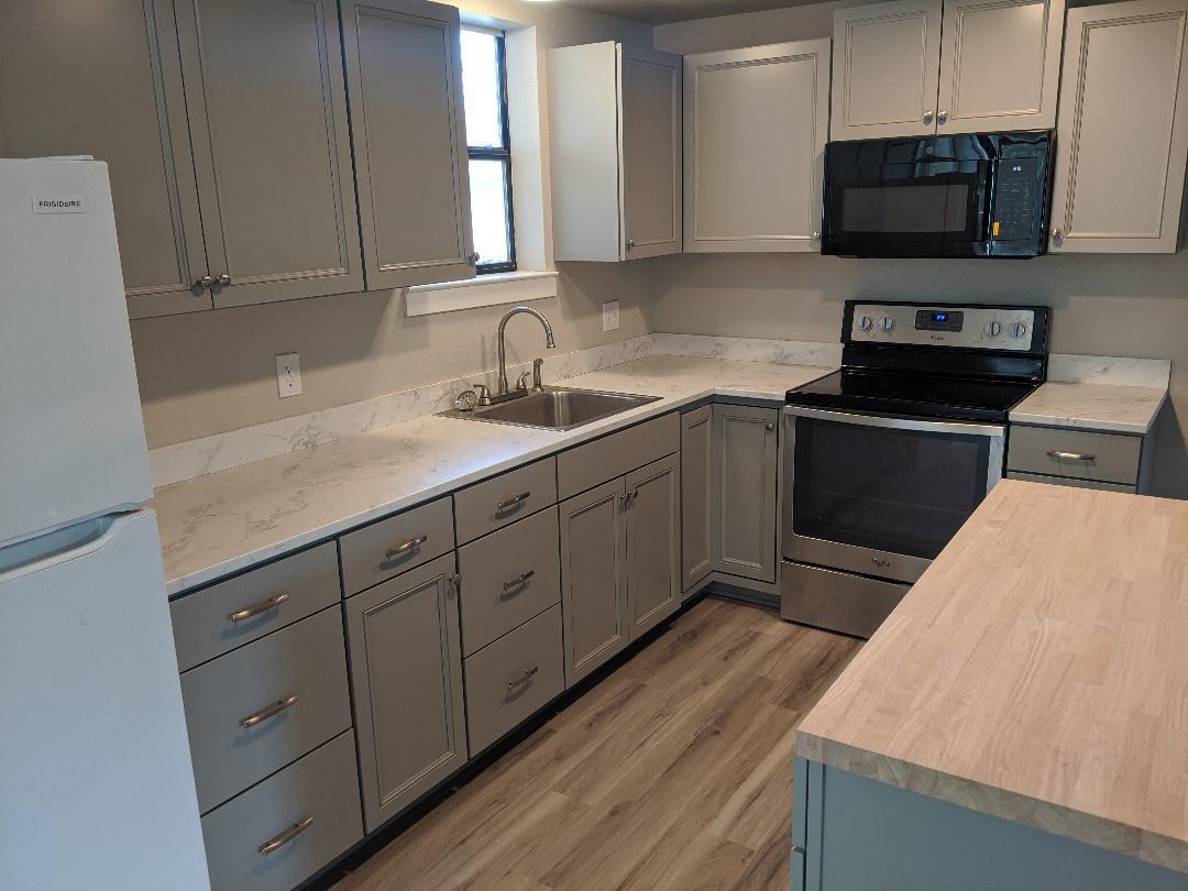 1012 State Street Redding, CA 96001 - Photo 10 of 23 a kitchen with sink cabinets and stainless steel appliances