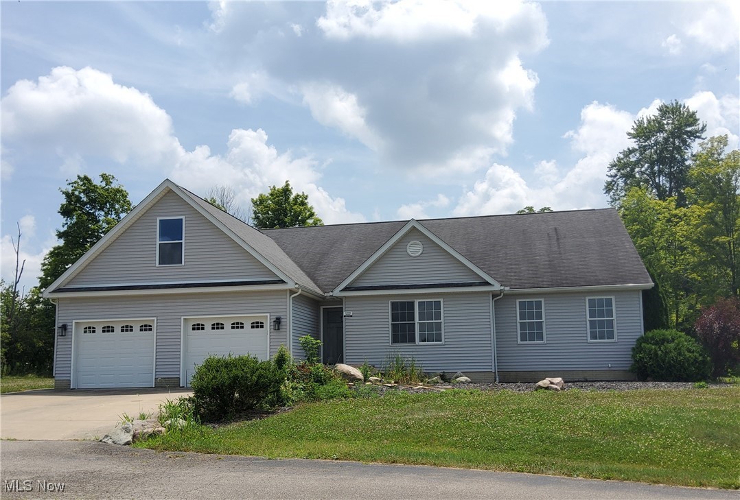 9415 Stone Road Litchfield, OH 44253 - Photo 2 of 28 Ranch home with 2-car garage.