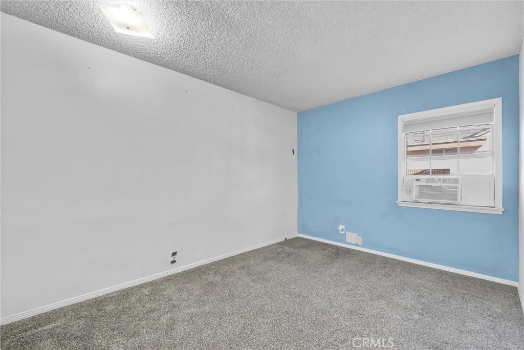 4741 Hazelbrook Avenue Long Beach, CA 90808 - Photo 15 of 22 an empty room with windows