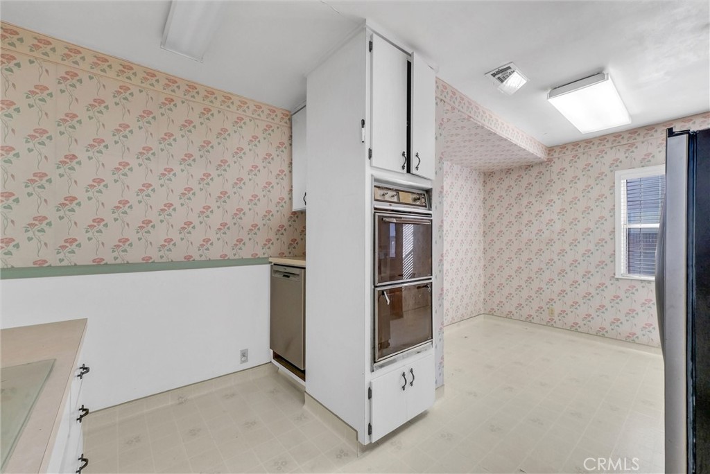 4741 Hazelbrook Avenue Long Beach, CA 90808 - Photo 7 of 22 a view of kitchen with entryway and white walls