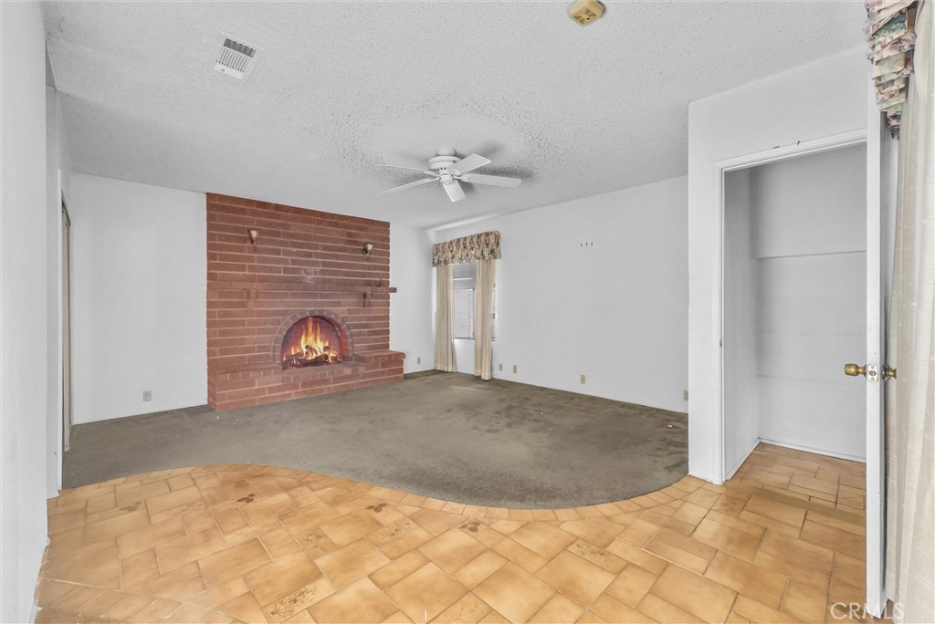 4741 Hazelbrook Avenue Long Beach, CA 90808 - Photo 10 of 22 a view of empty room with a fireplace