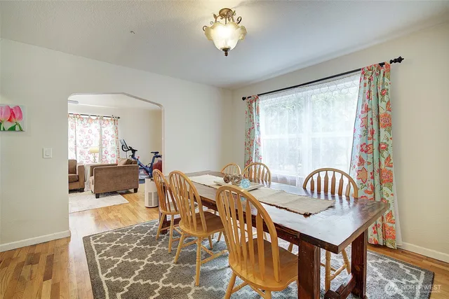 a view of a dining room with furniture and chandelier