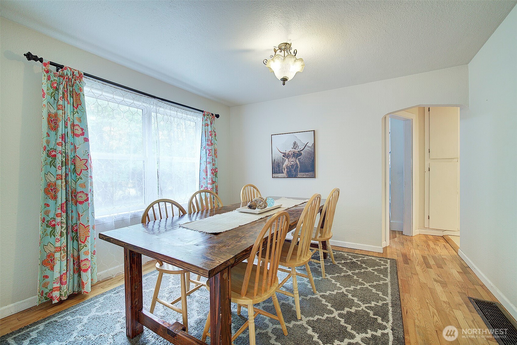 31612 8th Avenue South Roy, WA 98580 - Photo 16 of 40 a view of a dining room with furniture and wooden floor