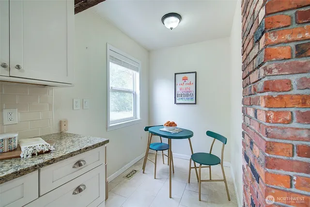 a kitchen with stainless steel appliances granite countertop a sink and a cabinets