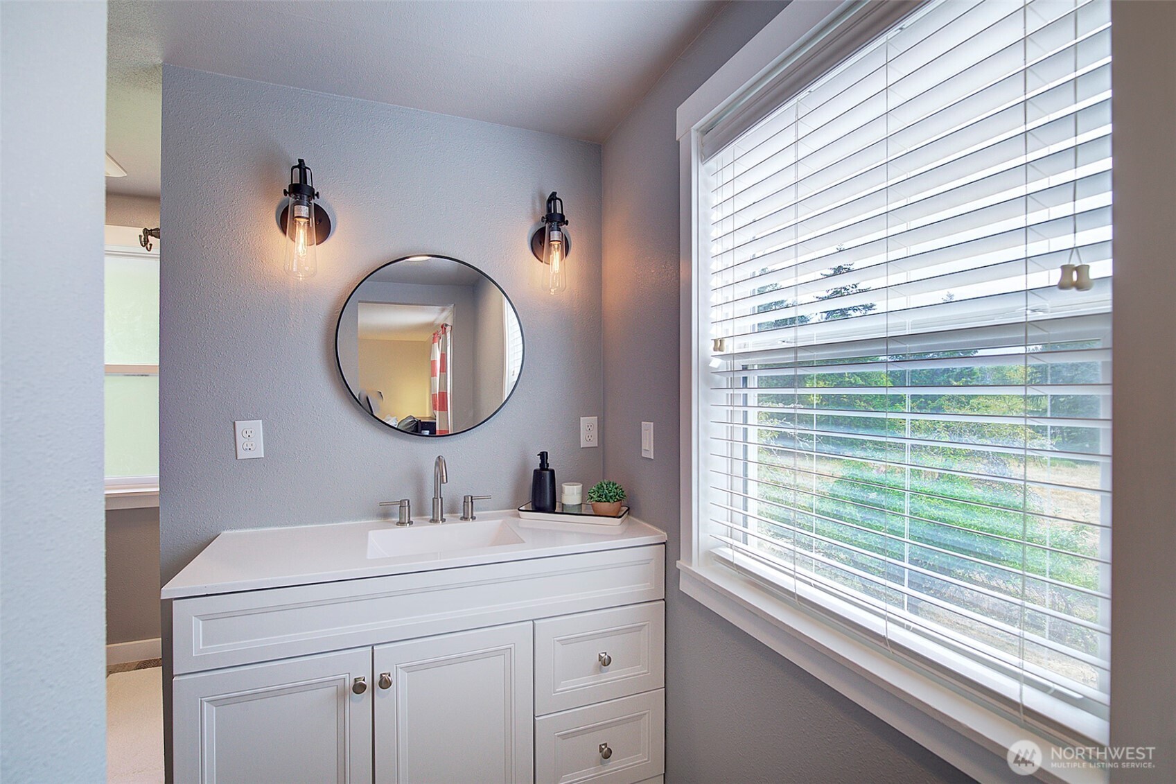 31612 8th Avenue South Roy, WA 98580 - Photo 35 of 40 a bathroom with a sink a mirror and a window
