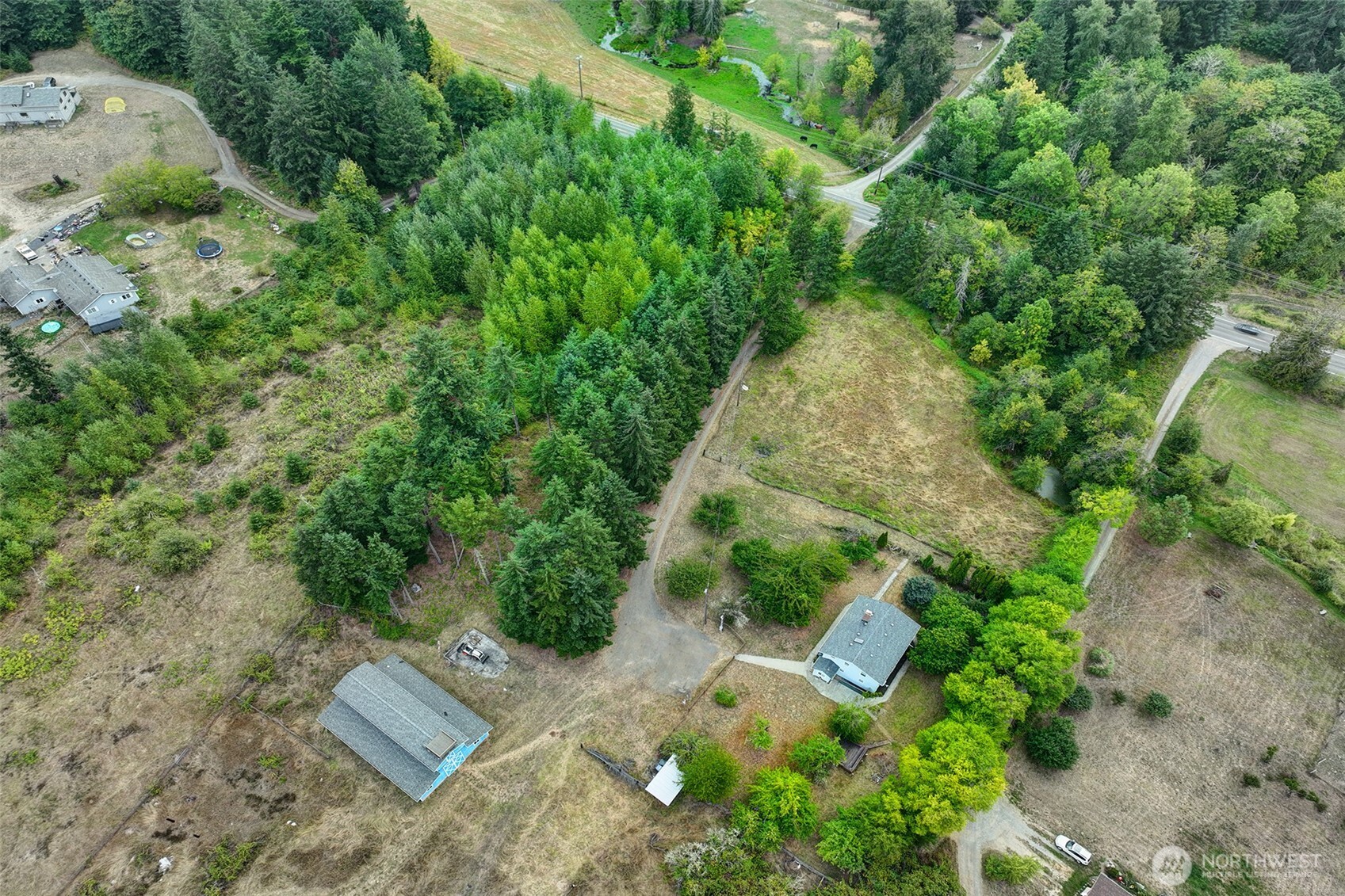 31612 8th Avenue South Roy, WA 98580 - Photo 4 of 40 an aerial view of a house with a yard