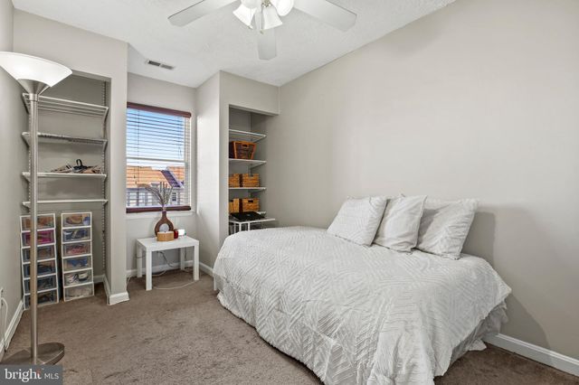 a bed room with a bed and furniture