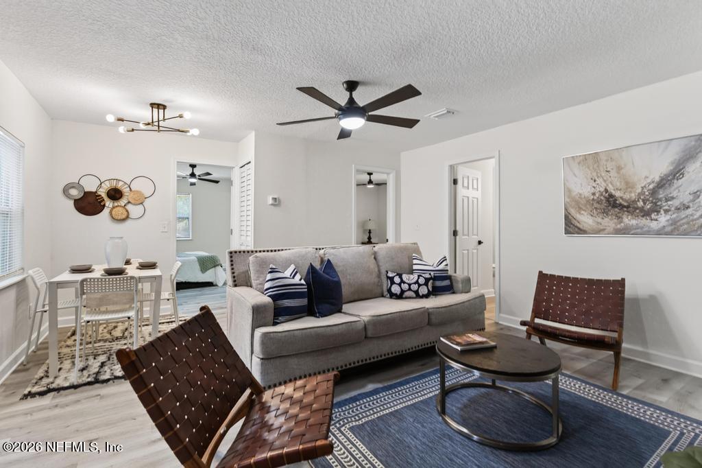 433 Lena Street St. Augustine, FL 32084 - Photo 13 of 42 a living room with furniture and a rug