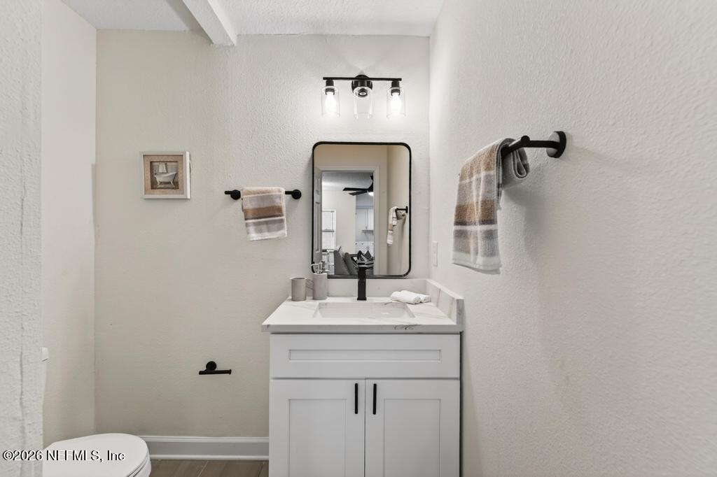 433 Lena Street St. Augustine, FL 32084 - Photo 19 of 42 a bathroom with a sink mirror and toilet