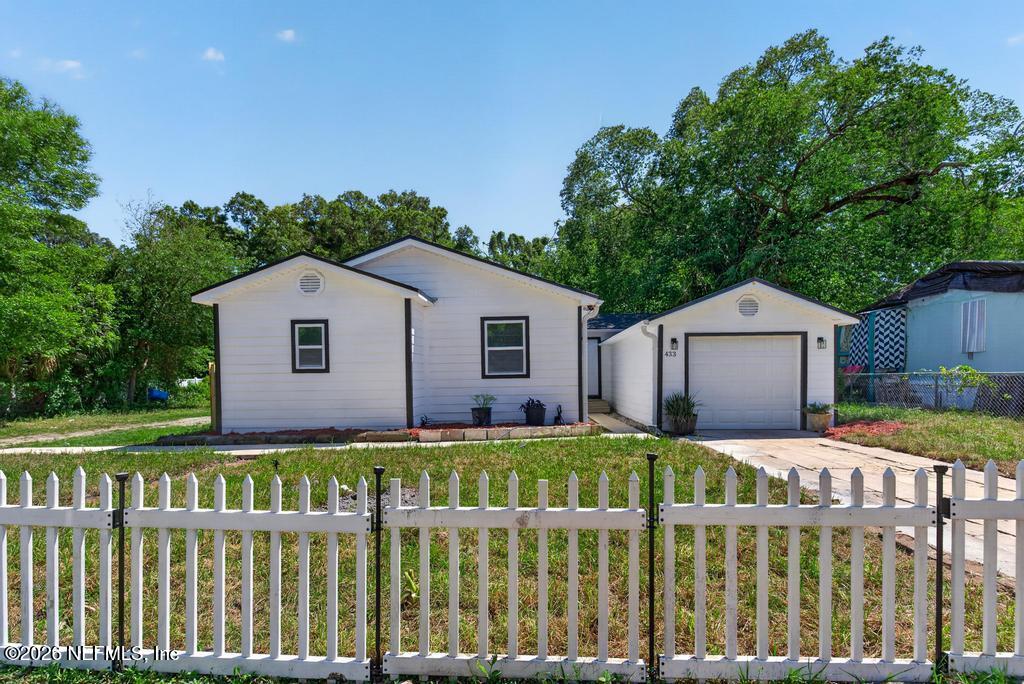 433 Lena Street St. Augustine, FL 32084 - Photo 2 of 42 a house view with a garden space