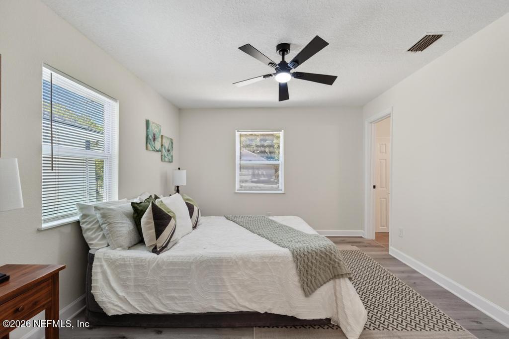 433 Lena Street St. Augustine, FL 32084 - Photo 21 of 42 a bedroom with a bed and window