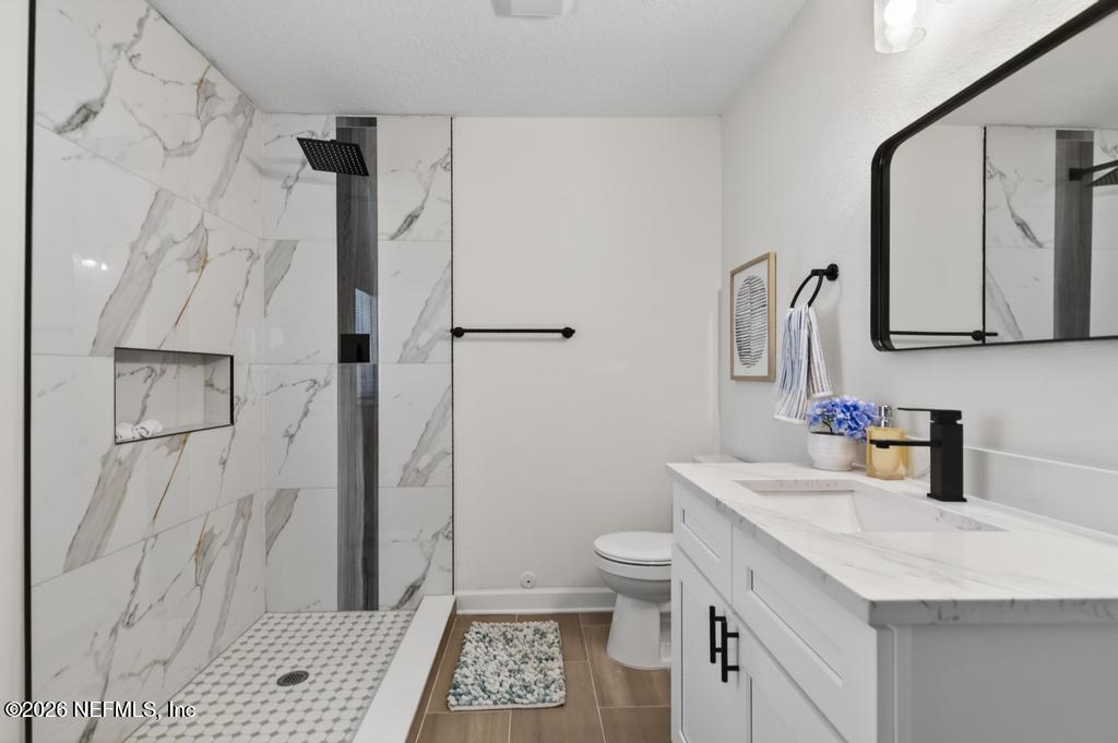 433 Lena Street St. Augustine, FL 32084 - Photo 24 of 42 a bathroom with a sink toilet and shower