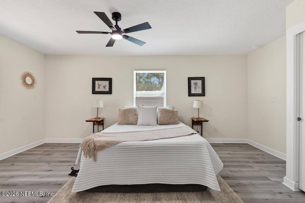 433 Lena Street St. Augustine, FL 32084 - Photo 28 of 42 a bedroom with a bed and a table