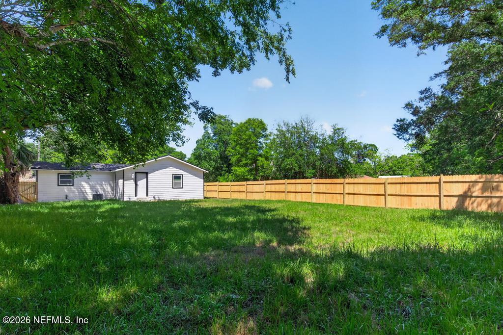 433 Lena Street St. Augustine, FL 32084 - Photo 41 of 42 a view of a tiny house with a yard