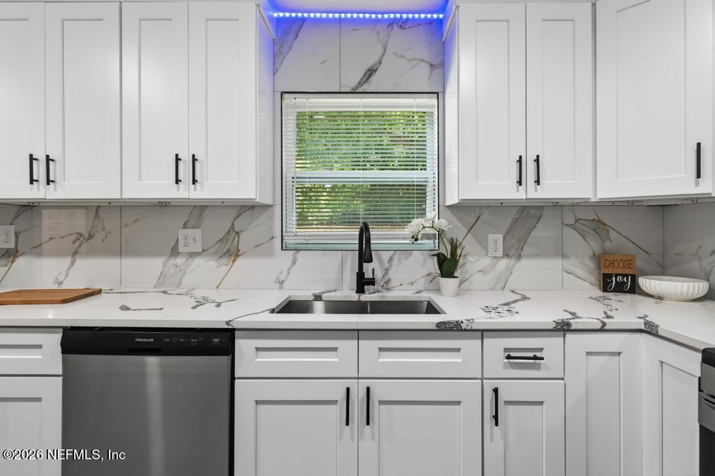 433 Lena Street St. Augustine, FL 32084 - Photo 9 of 42 a kitchen with a sink cabinets and window