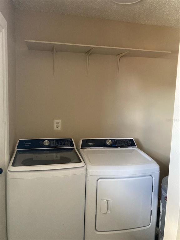 1306 Golconda Road Lakeland, FL 33801 - Photo 5 of 13 a utility room with dryer and washer