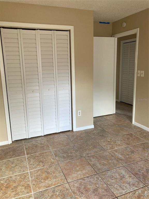 1306 Golconda Road Lakeland, FL 33801 - Photo 7 of 13 a view of an empty room with wooden floor