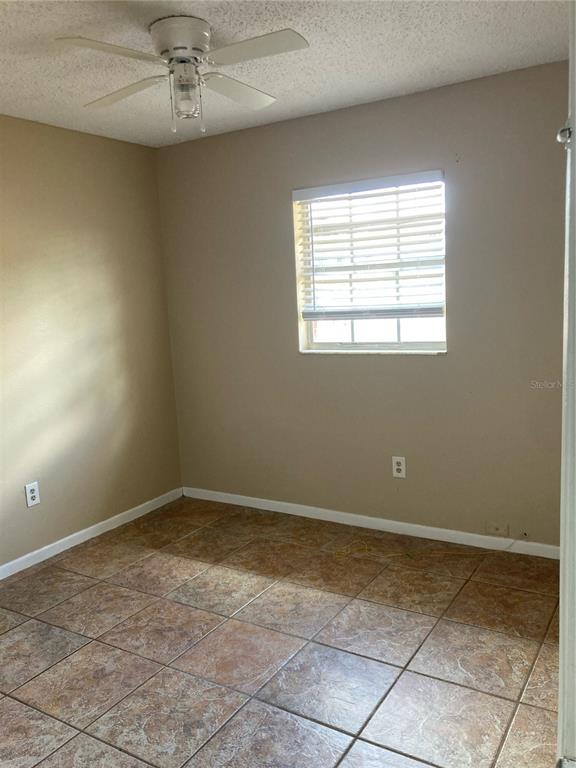 1306 Golconda Road Lakeland, FL 33801 - Photo 10 of 13 a view of an empty room with a window