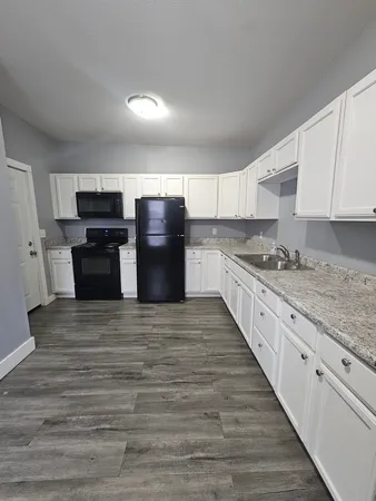 a view of a small space with wooden floor