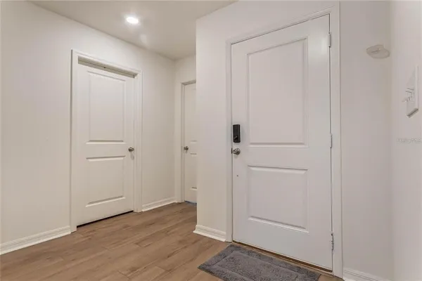 an empty room with wooden floor