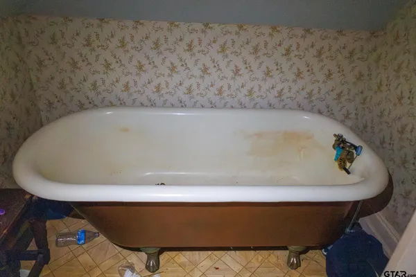 a bath tub sitting in a bathroom