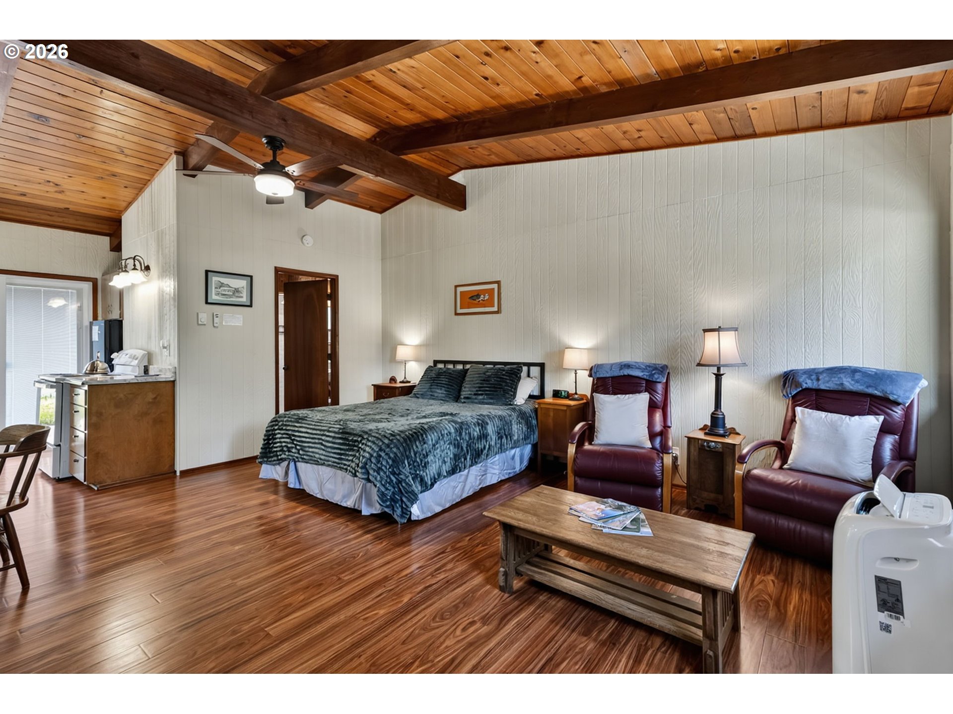 46725 Goodpasture Road Vida, OR 97488 - Photo 26 of 48 a bedroom with a bed and wooden floor