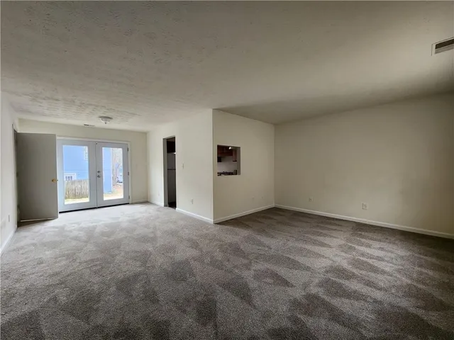 a view of empty room with windows