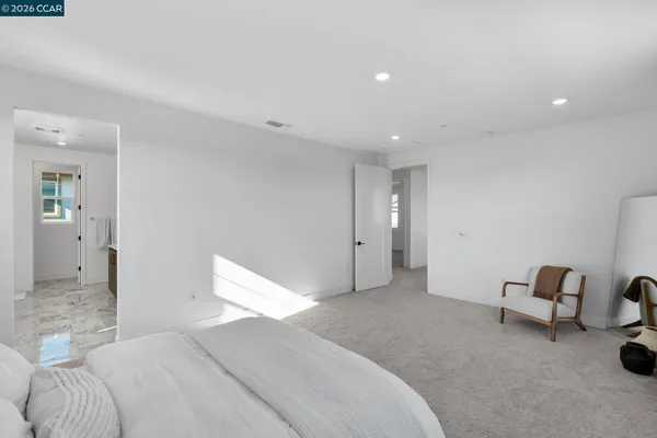 a bath tub sitting in a bathroom next to a window